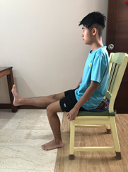 extend one leg to straighten the knee.