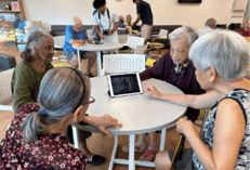 A group of people sitting at a table

AI-generated content may be incorrect.