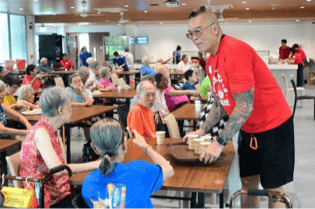 A person serving food to a group of people
AI-generated content may be incorrect.