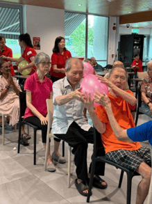 A group of people sitting in chairs
AI-generated content may be incorrect.