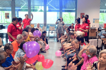 A group of people sitting in a room
AI-generated content may be incorrect.