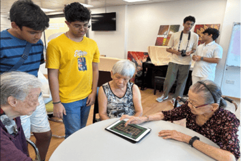 A group of people around a table

AI-generated content may be incorrect.